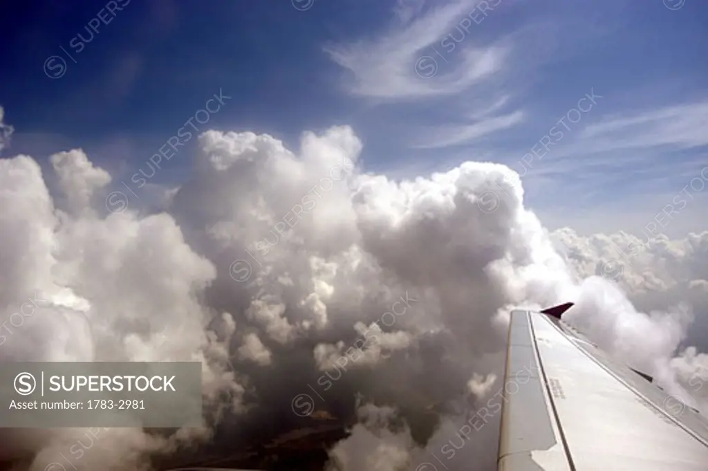 Looking out over the wing of Air Jamaica plane whilst ascending through clouds.