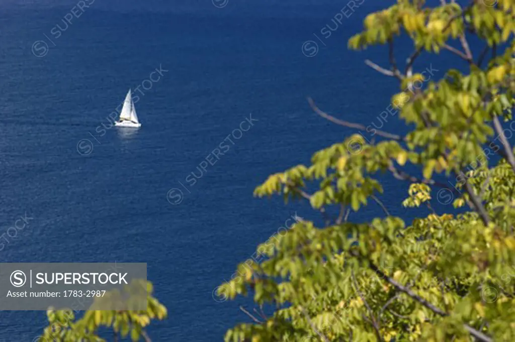 Yacht sailing past Pigeon Island, St Lucia.