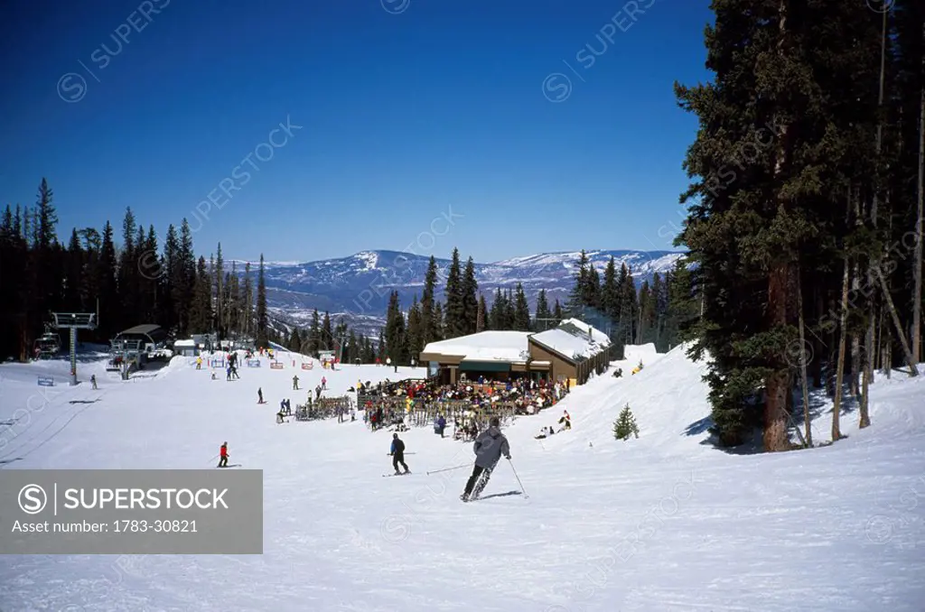 Mountain restaurant and People skiing, Colorado, USA