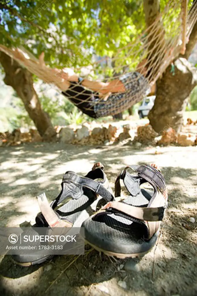 Man lying in hammock in sunlight, Turkey