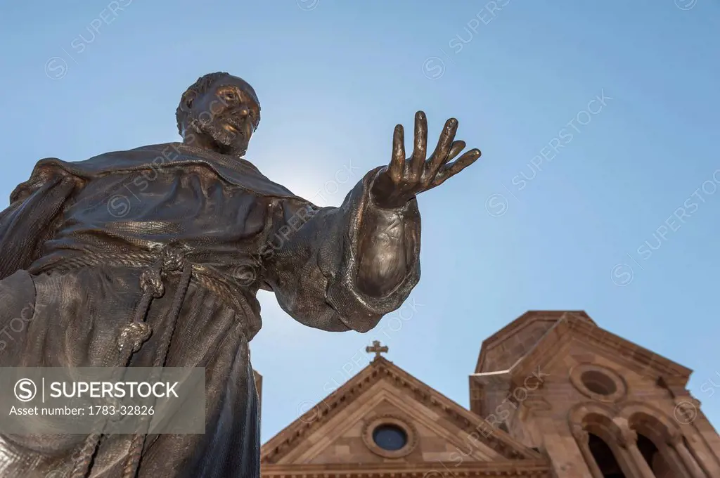 A Statue Of St. Francis Of Assisi Prominently Adorns The Front Entrance Of The St. Francis Cathedral In Santa Fe, New Mexico, Usa.