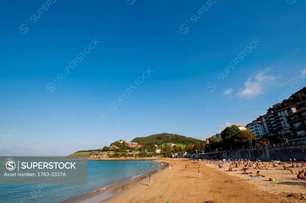 Sunbathing On The Beach, Lekeitio, Basque Country, Spain