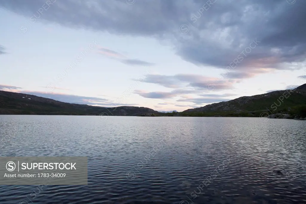 Sweden, Lapland, Lake at evening; Miekak