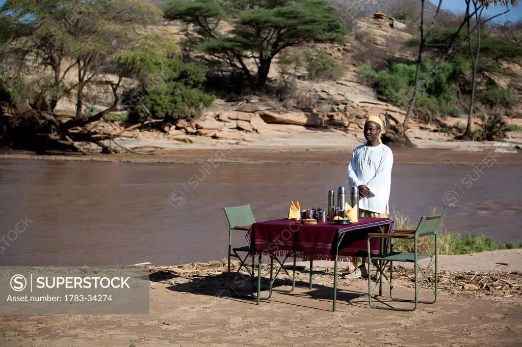Shaba National Reserve; Kenya, Riverside breakfast table set up for guests at Joy's Camp