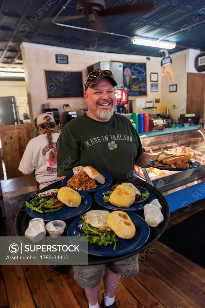The Cowboy Gelato Restaurant Owner Jim Anderson Serving A Selection Of Homemade Burgers And Sandwiches, Route 66, Amarillo, Usa