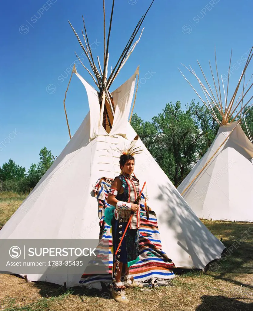 Crow Teenager In Front Of His Tepee