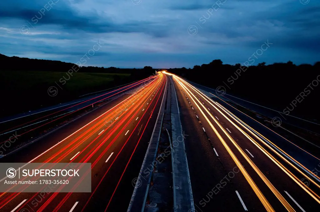 Car Trails On The Freeway At Night In Wiltshire, Uk