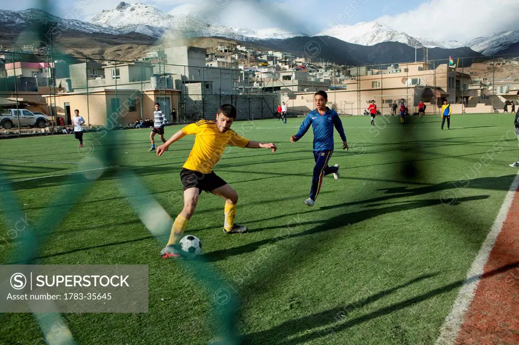 Boys Playing On The Football Pitch Close To The Iran Border In Iraqi Kurdistan, Iraq