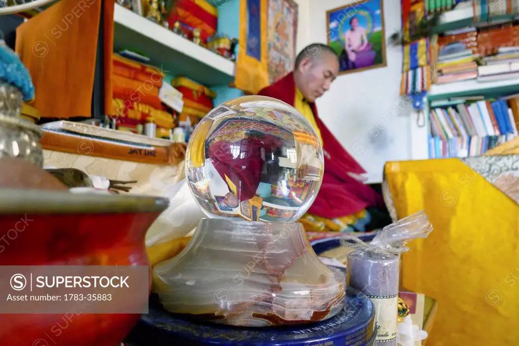 Chamtrul Rinpoche's Upside Down Reflection In A Crystal Ball As He Teaches In The Background, Mcleod Ganj, Himachal Pradesh, India