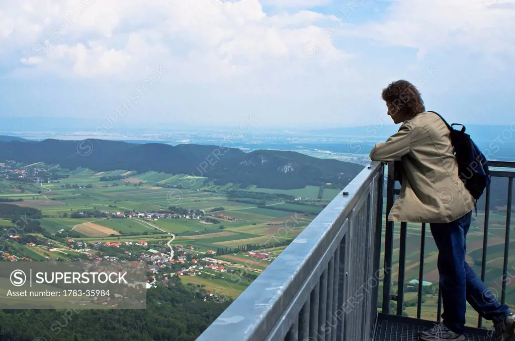 Austria, Man contemplating landscape in Hohe Wand Naturpark; Hohe Wand