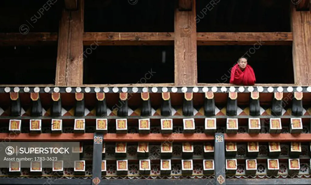 Monk in window of dzong, Paro, Bhutan
