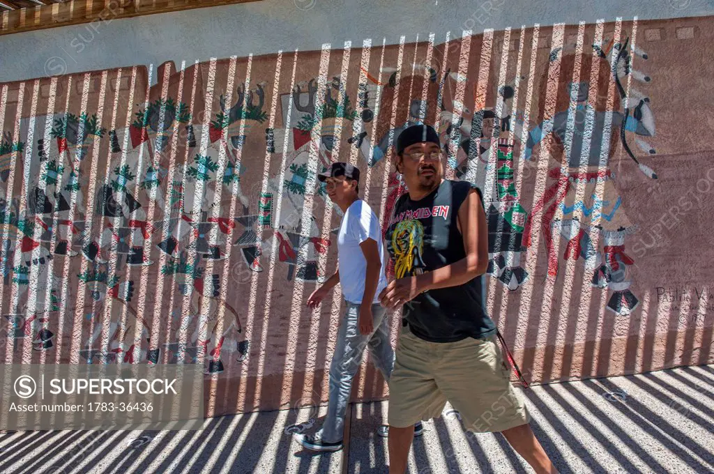 People Walking Against Mural At Indian Pueblo Cultural Center, Albuquerque, New Mexico, Usa