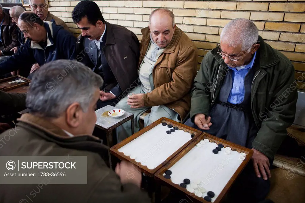 Men Playing Backgammon In The Sha'ab Chai Khana Teahouse, Sulaymaniyah, Iraqi Kurdistan, Iraq