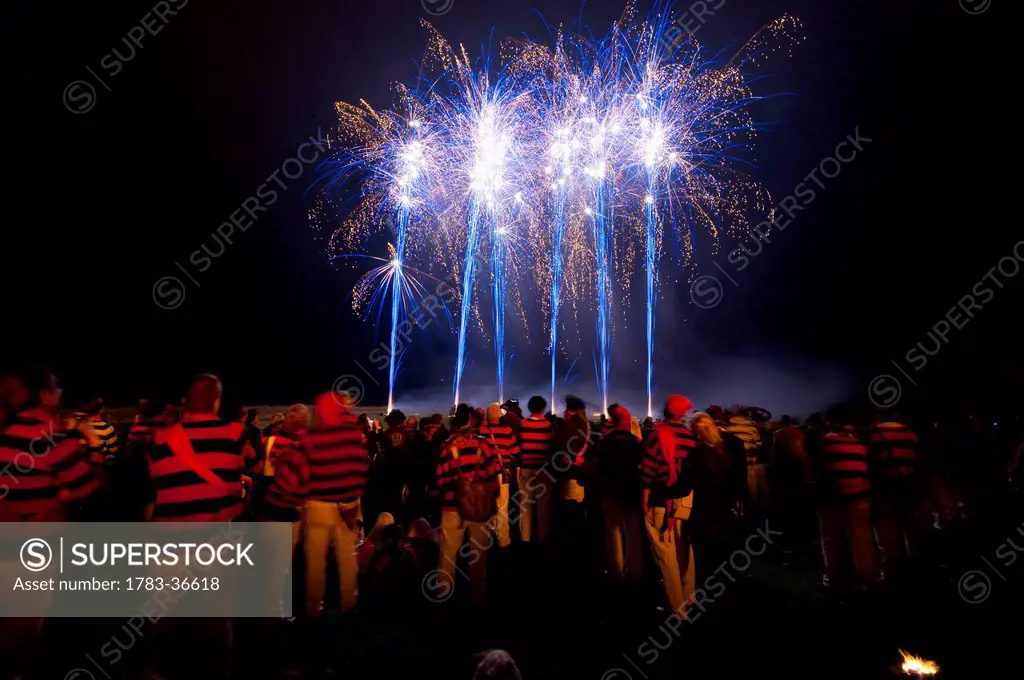 People From Southover Bonfire Society Watch The Fireworks On Bonfire Night, Lewes, East Sussex, Uk
