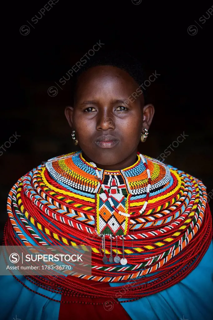 Kenya, Portrait of young Samburu woman in traditional dress; South Horr