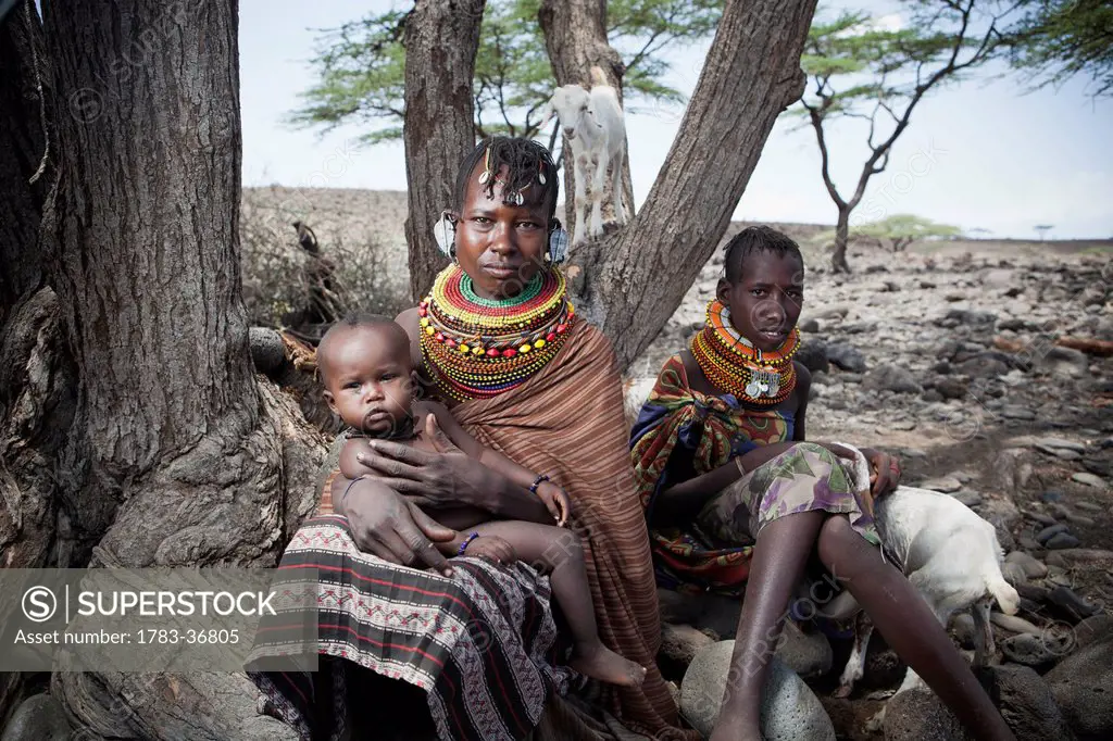Kenya, Portrait of traditionally dressed Turkana women and child; Loyangalani