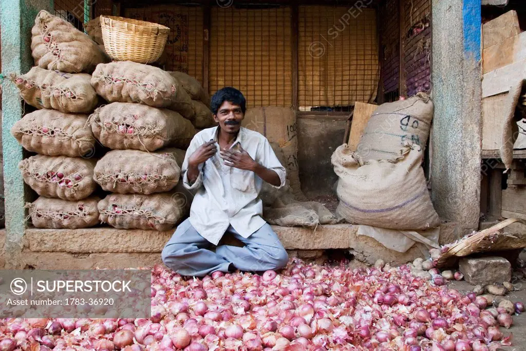 Onion Seller At Devaraja Market In Mysore, Karnataka, India