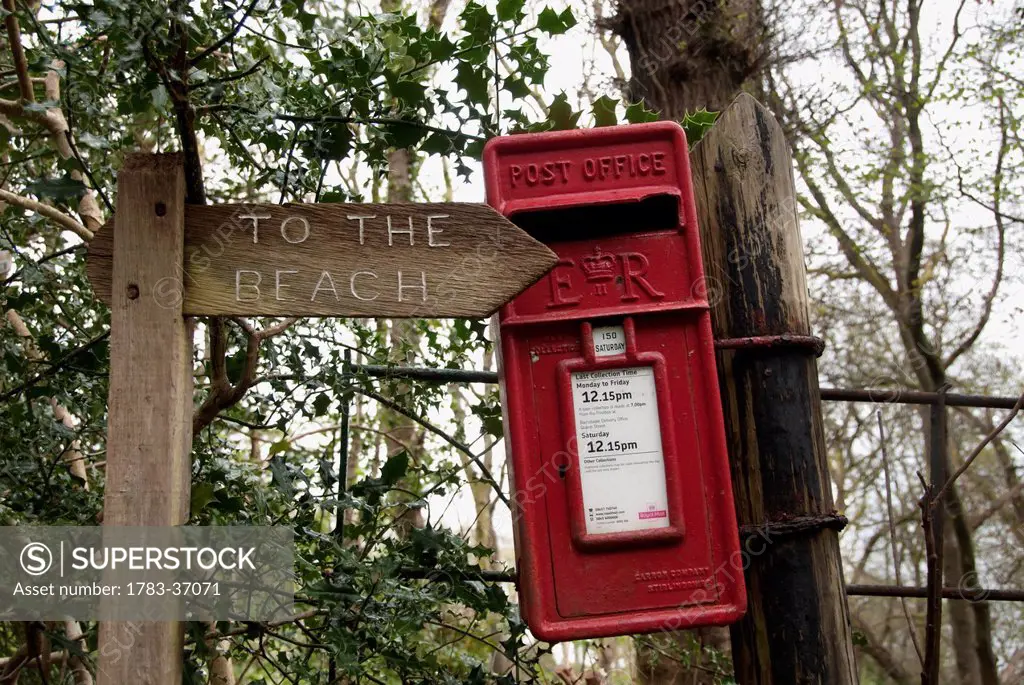 Wooden Sign And Red Uk Postal Box Along The South West Coast Path Near Lynmouth, Exmoor, United Kingdom