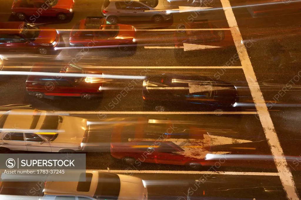 Traffic going across busy junction at night; Casablanca, Morocco