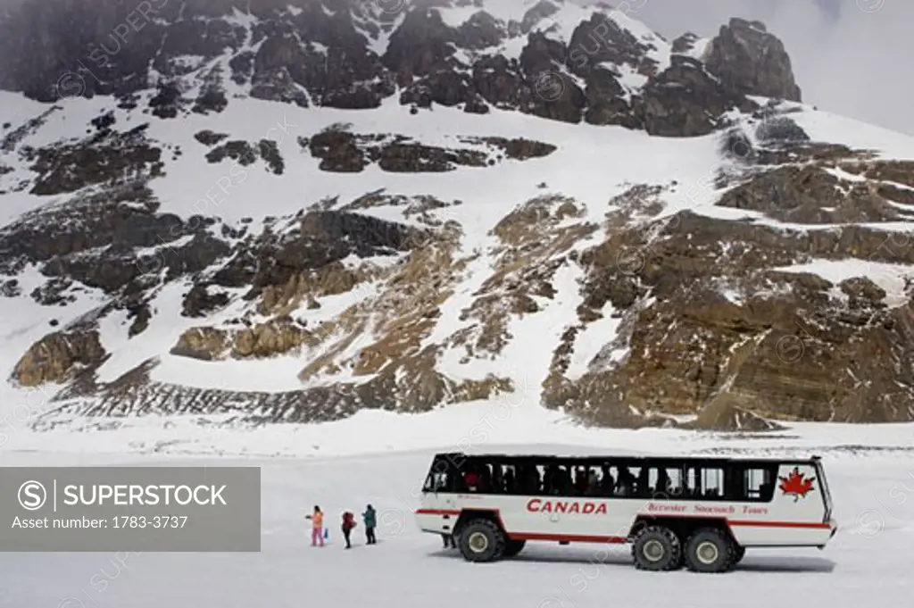 Snowcoach, mountains in background, Alberta, Canada