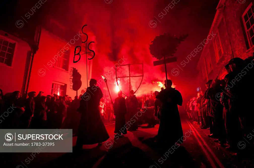 People dressed as monks from Southover Bonfire Society lead Grand Procession through streets of Lewes on Bonfire Night; Lewes, East Sussex, England, U...