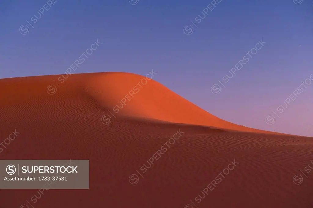 Sand dune at dusk near Merzouga in Sahara Desert; Erg Chebbi, Morocco