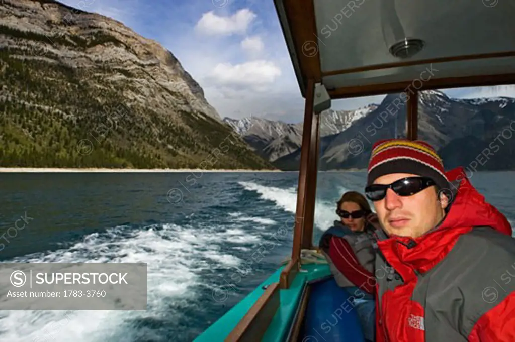 People on a boat tour on Lake Minnewanka, Banff National Park, Alberta, Canada