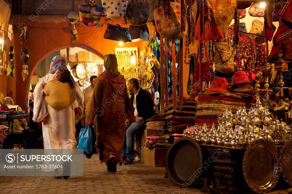 Women walking through souk; Marrakesh, Morocco