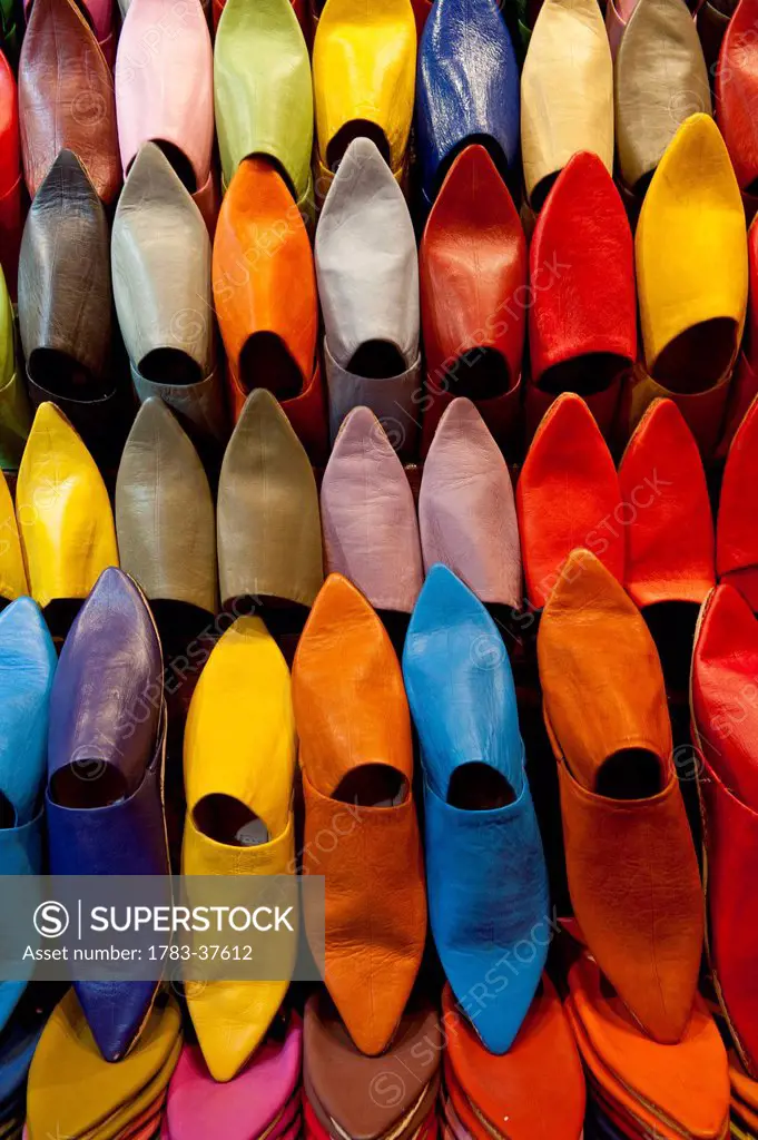Colorful selection of Babouche slippers for sale in souk; Marrakesh, Morocco