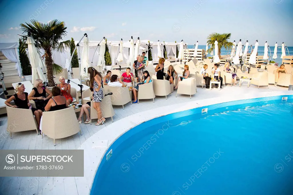 Poolside at high class nightclub on beach, swinging nightlife; Odessa, Ukraine