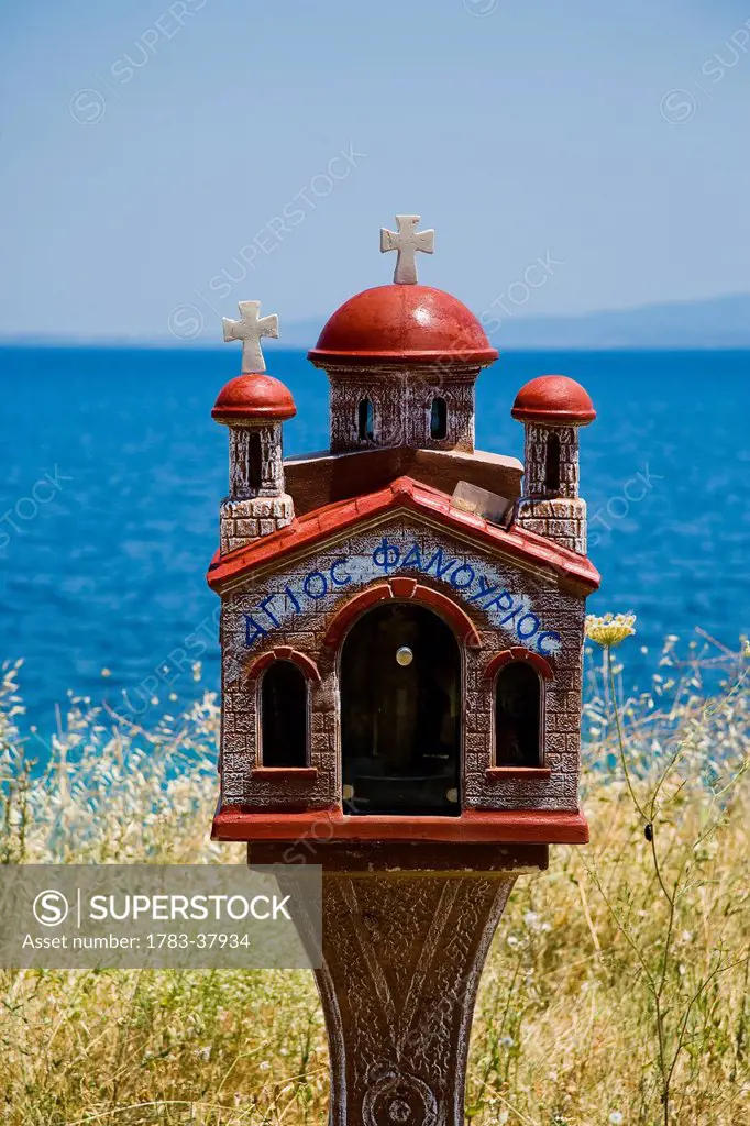Miniature church shrine overlooking Mediterranean sea; Sithonia, Halkidiki, Greece