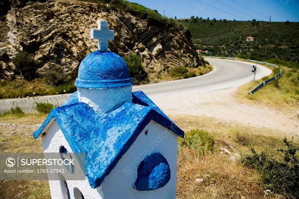 Rusty miniature church roadside shrine; Sithonia, Halkidiki, Greece