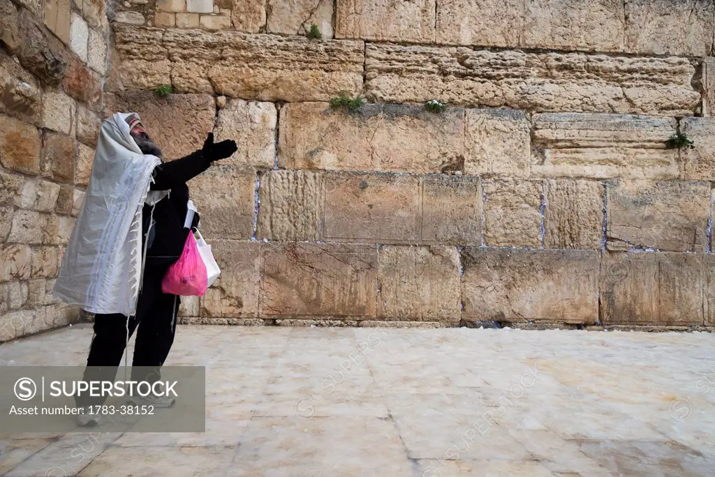 Orthodox Jew standing in front of wall, January 10, 2013, Western Wall; Jerusalem, Israel