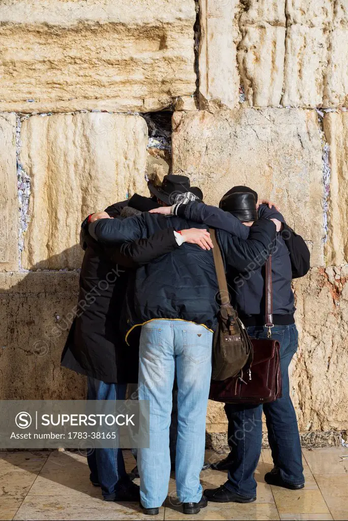 Group of pilgrims praying together at Western Wall; Old City, Jerusalem, Israel