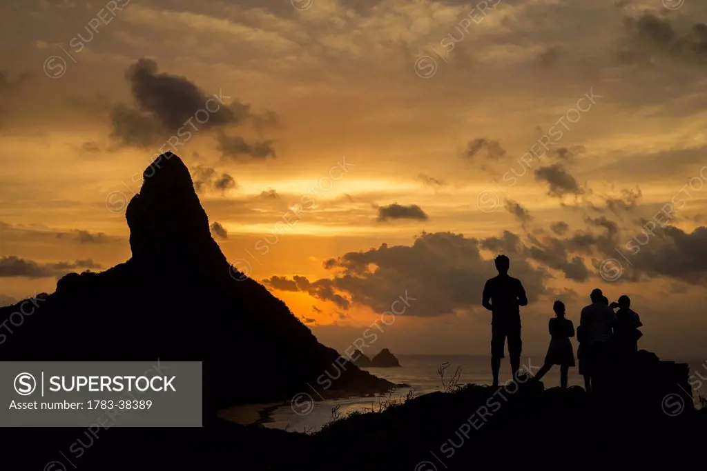People admiring sunset over Morro do Pico; Fernando de Noronha, Pernambuco, Brazil