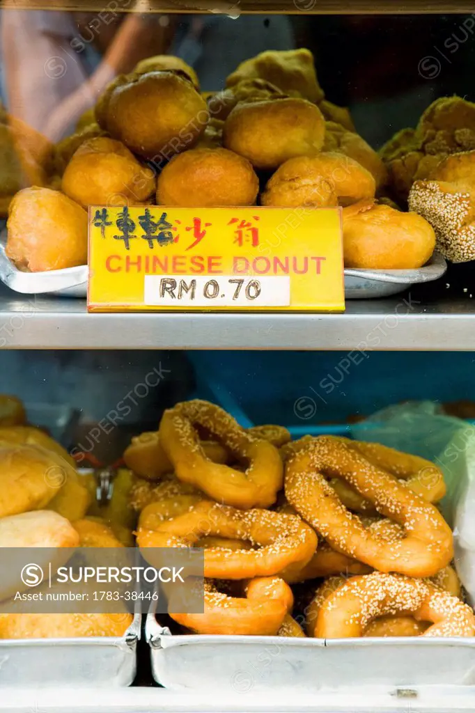 Chinese donuts for sale out in street; Jalan Petaling (Petaling Street), Chinatown; Kuala Lumpur, Malaysia