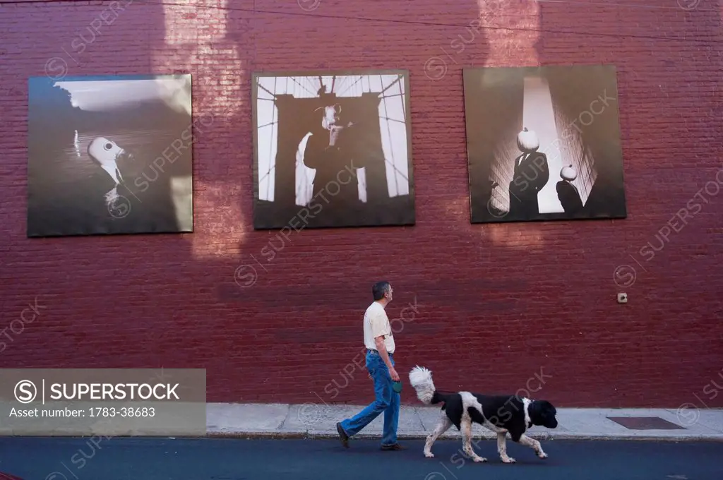 Side view of man with dog; Charlottesville, Virginia, USA