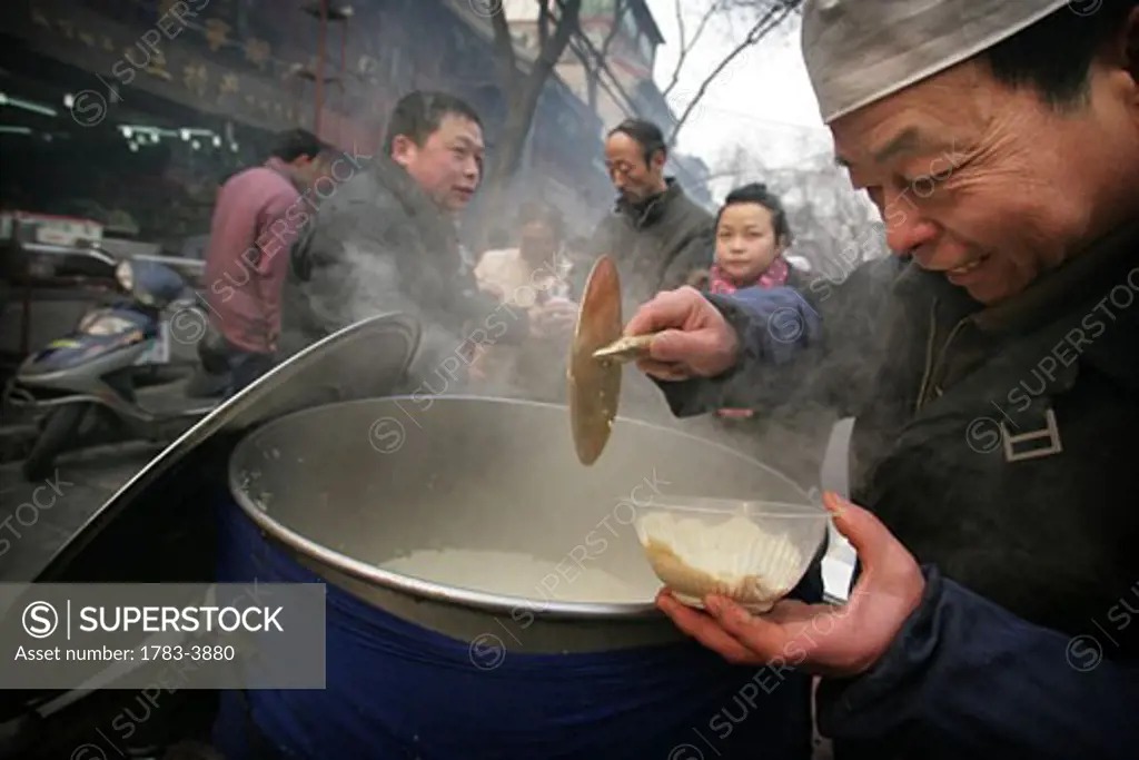 Street stall selling food in the Muslim Quarter, Xian, Xi'an, Capital of Shaanxi Province, China 