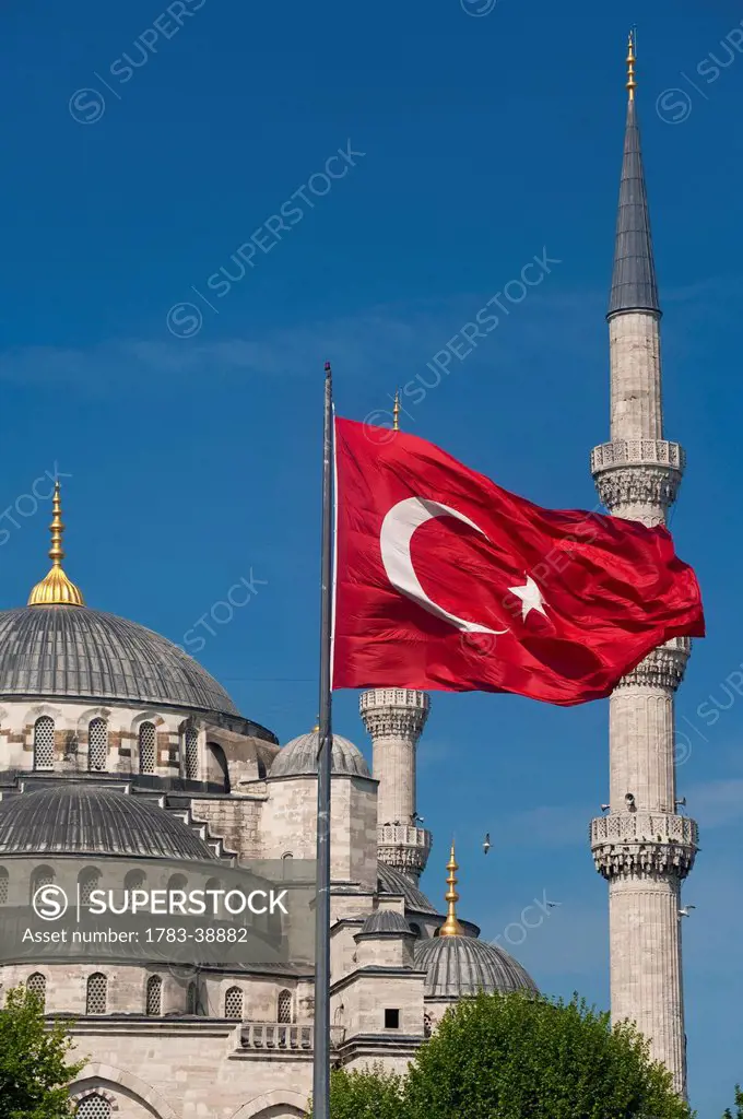 Turkish flag in front of Sultanahmet Blue Mosque; Istanbul, Turkey