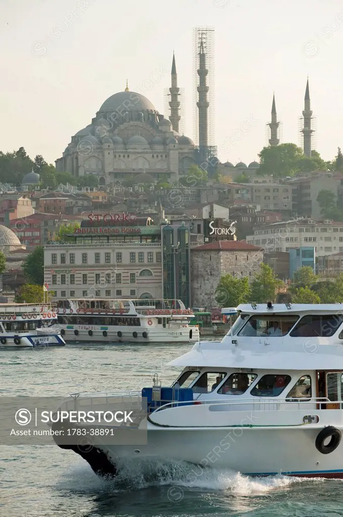 Ferries crossing Golden Horn with Suleymaniye Mosque behind; Istanbul, Turkey