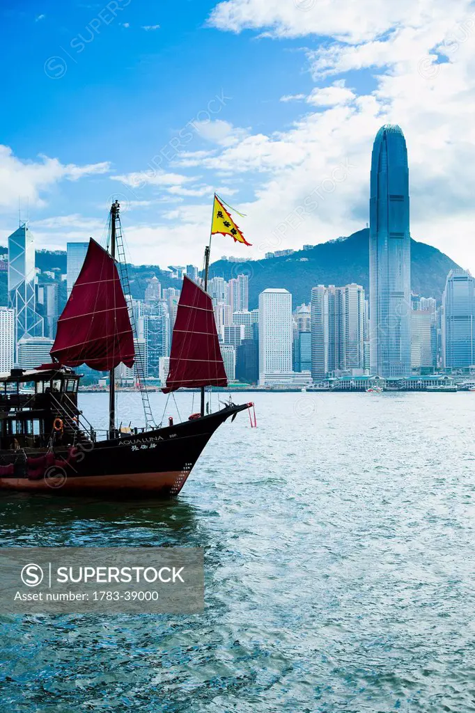 Traditional Chinese Junk boat, converted for tourists rides around harbor; Victoria Harbor, Hong Kong Island, China