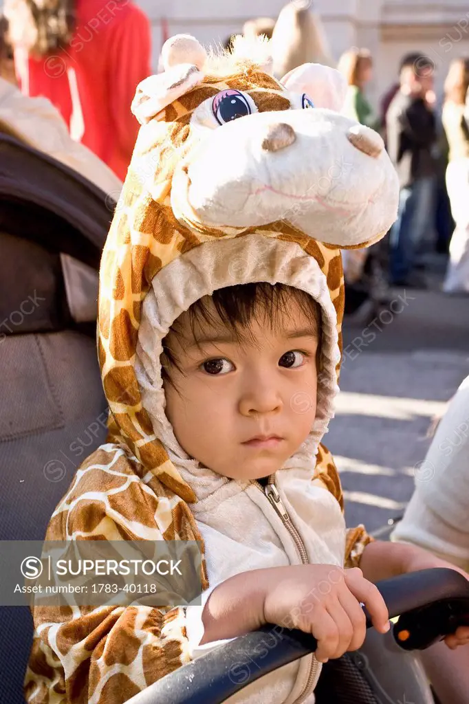USA, New York State, Baby boy in giraffe Halloween costume; New York City