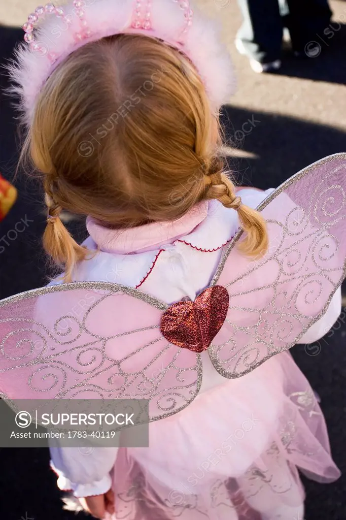USA, New York State, Girl in fairy Halloween costume; New York City