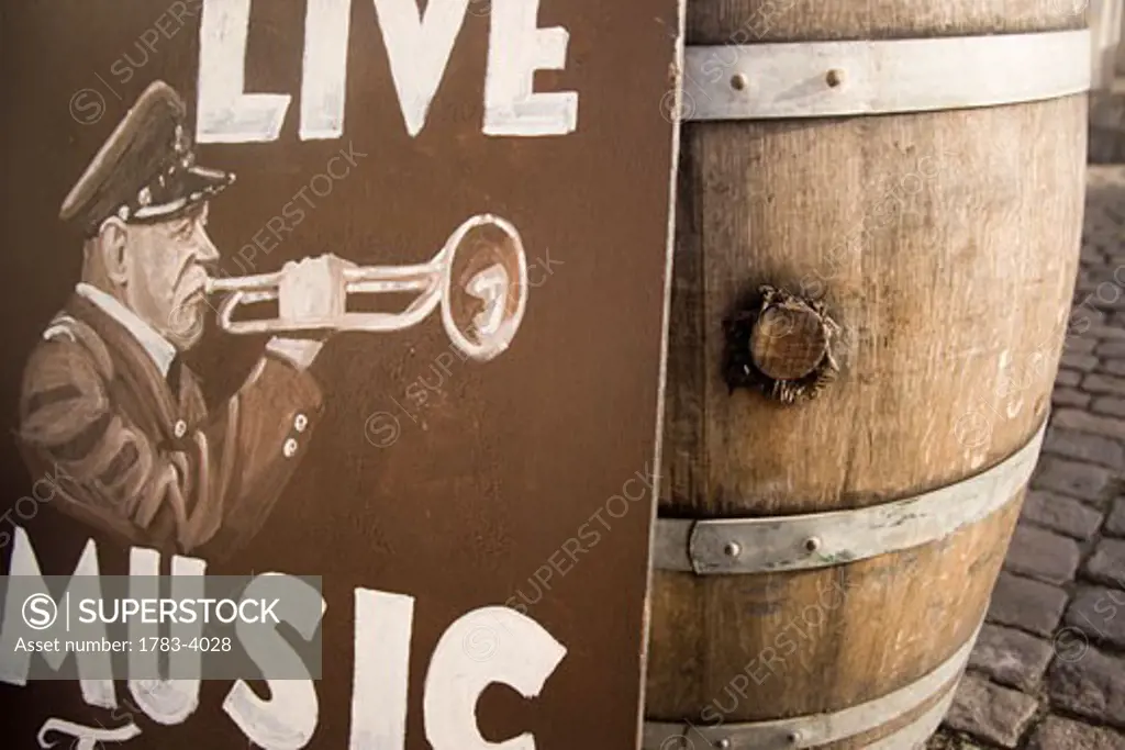 Sign for live music next to barrel, Nyhavn, Copenhagen, Denmark