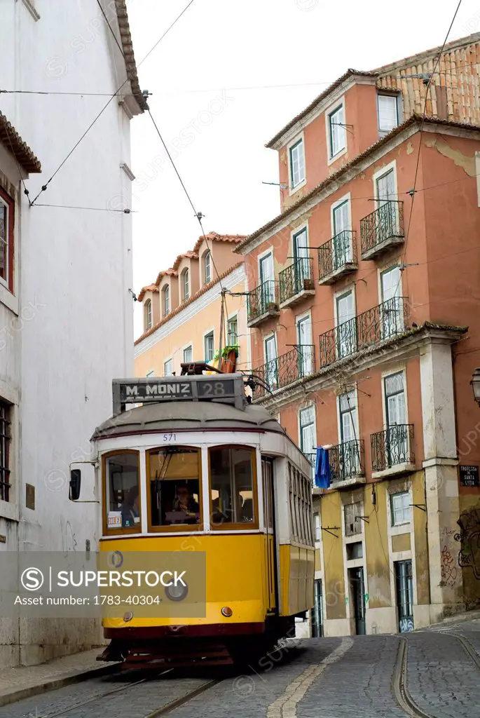 Tram around Castelo de Sao Jorge, Lisbon, Portugal, March'08, © Dosfotos/Axiom