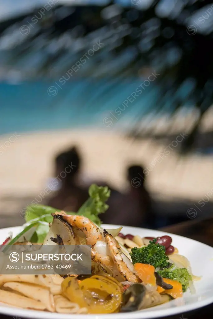 BBQ'd prawns with salad, The Aquarium Restaurant, Point Salines Beach, Grenada. © Ian Cumming / Axiom