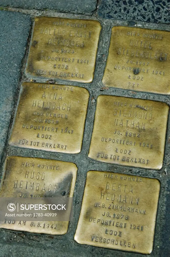 Germany, Brass cobbles as memorial marking addresses of Jews deported from city during Nazi period; Cologne