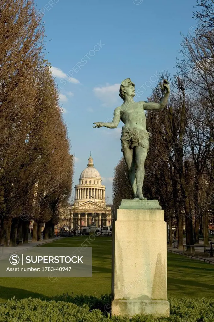 France, Paris, with neo-classical Pantheon in background; Jardin du Luxembourg, Statue of Greek god Pan