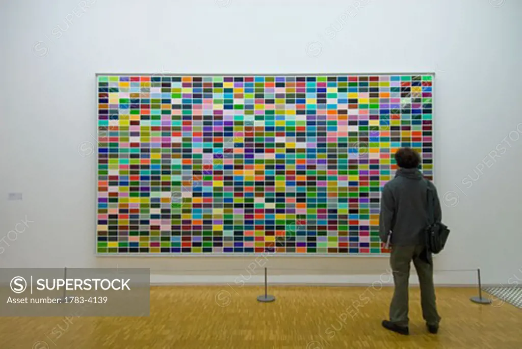 A man looking at a painting in the Pompidou Centre Museum of Modern Art , 1024 Farben (1024 colours) by Gerhard Richter (1973), Paris, France 