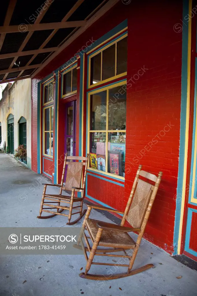USA, Florida, Chairs outside antique shop; Micanopy